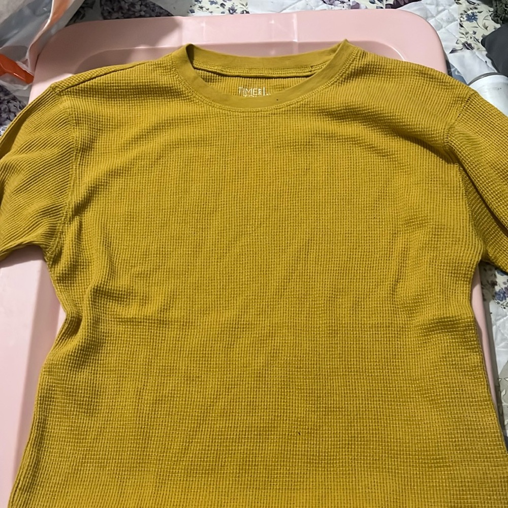 A yellow long sleeve. (Never been wore)